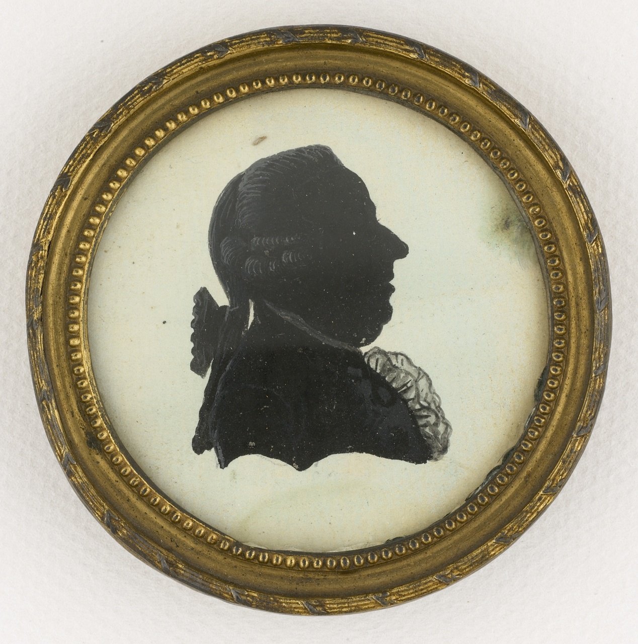 Miniatuur imitatieknipsel met portret en profil van P. Ackermans